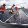 August 19, 2010-NREL workers install PV panels on the roof of the RSF at NREL in Golden, CO. ( Photo by Dennis Schroeder)