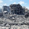 Palestinians inspect the damage following an Israeli airstrike on the El-Remal aera in Gaza City on October 9, 2023. Israel continued to battle Hamas fighters on October 10 and massed tens of thousands of troops and heavy armour around the Gaza Strip after vowing a massive blow over the Palestinian militants' surprise attack. Photo by Naaman Omar apaimages